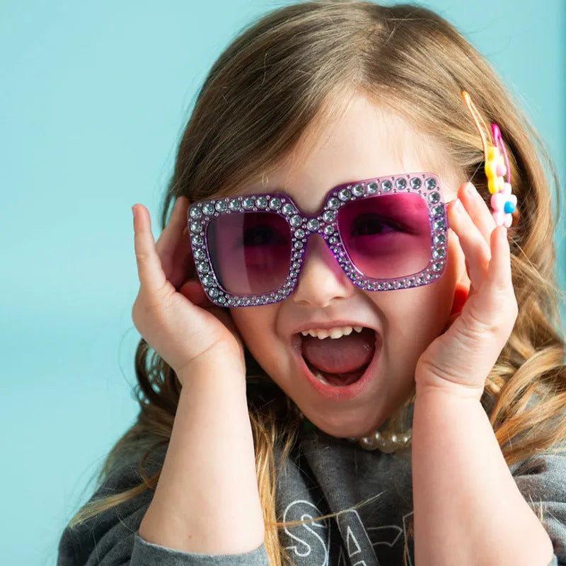 Plastic fashion sunglasses in a box showing various frame and lens colour options.
