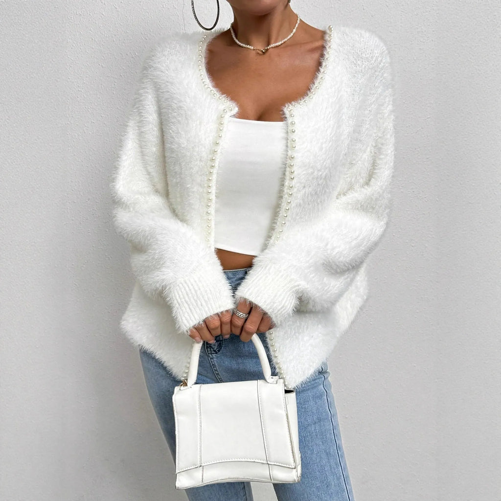 White women's V-neck cardigan with bead knit detail on medium thickness polyester fabric