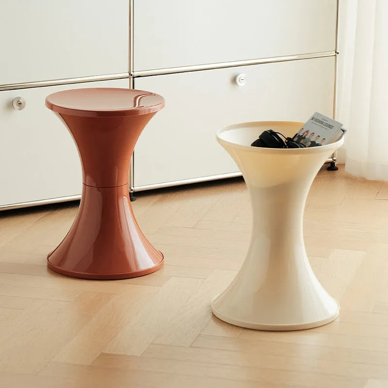 Plastic hourglass shoe changing stool in selected colour on flat surface