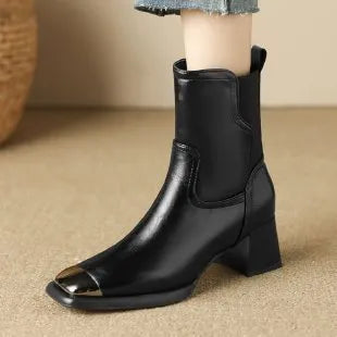 Brown cowhide leather women's ankle boots with a high heel and side zipper closure on a white background.