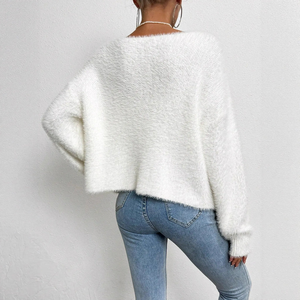 White women's V-neck cardigan with bead knit detail on medium thickness polyester fabric
