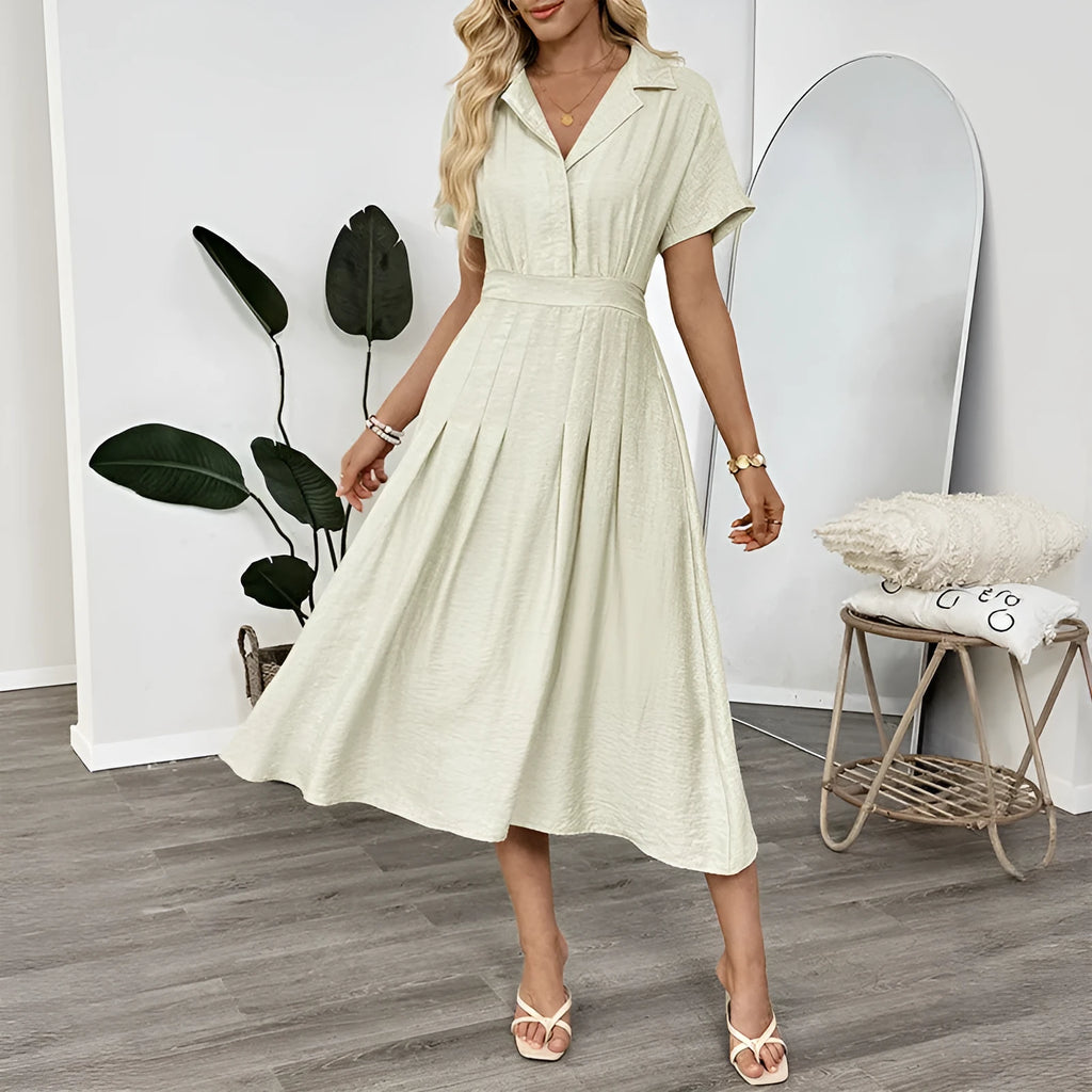 Light green women's shirt dress with lapel collar, waist tie, and side pockets.