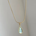 Retro blue and green water drop pendant necklace on a titanium steel snake bones chain.