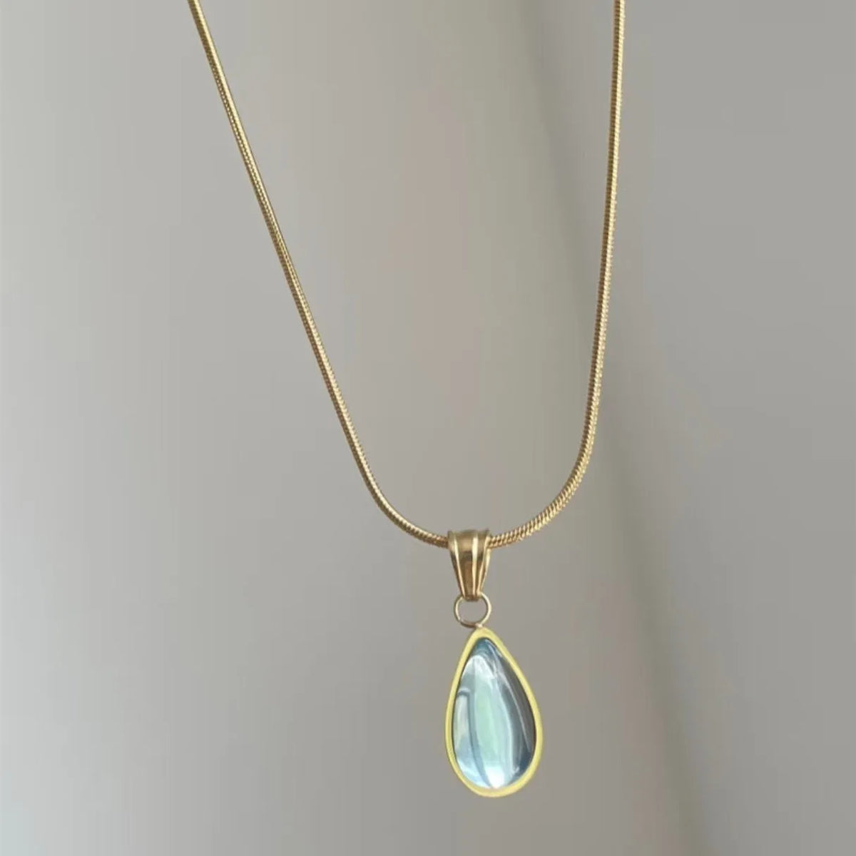 Retro blue and green water drop pendant necklace on a titanium steel snake bones chain.
