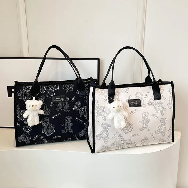 Women's black canvas tote bag with rhombus pattern and sandwich pocket