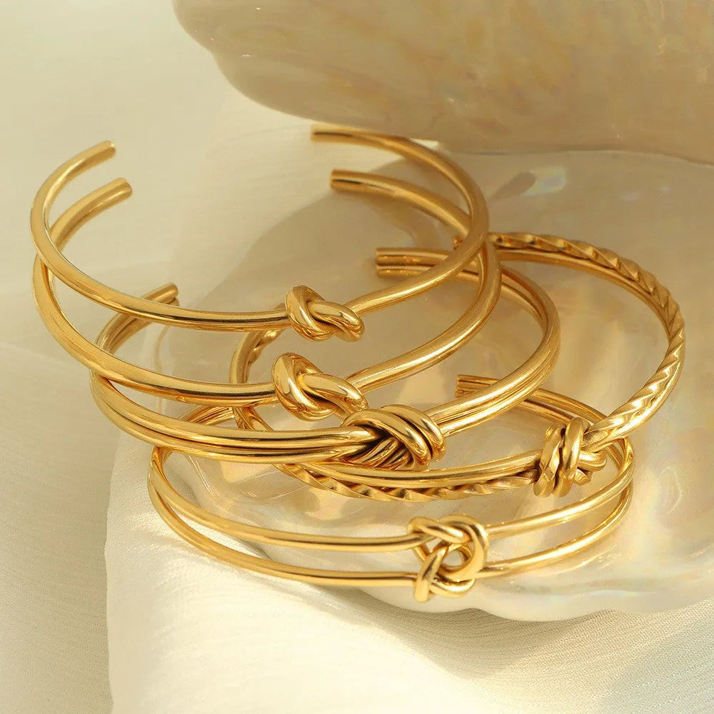 Adjustable stainless steel C-shaped bracelet with double-layer knotted design in gold or silver finish