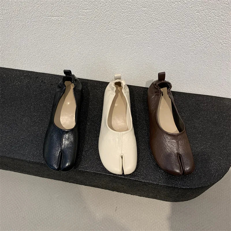 Women's apricot chunky heel pumps with a round toe and distinctive split toe horseshoe design.