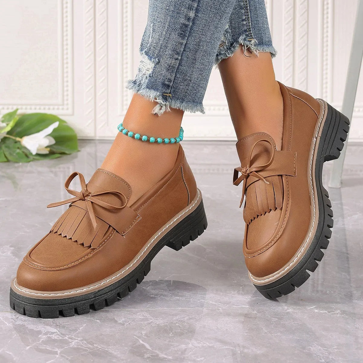 Plus size women's loafers with chunky heel in black and brown colours showing round toe design