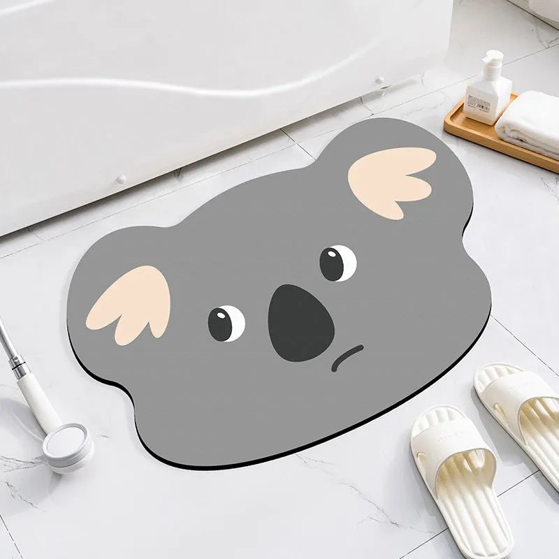 Thickened diatom ooze absorbent bathroom mat with cartoon animal design on a bathroom floor.