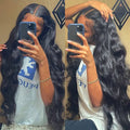 Black synthetic front lace wig with long curly hair and side bangs in exotic style