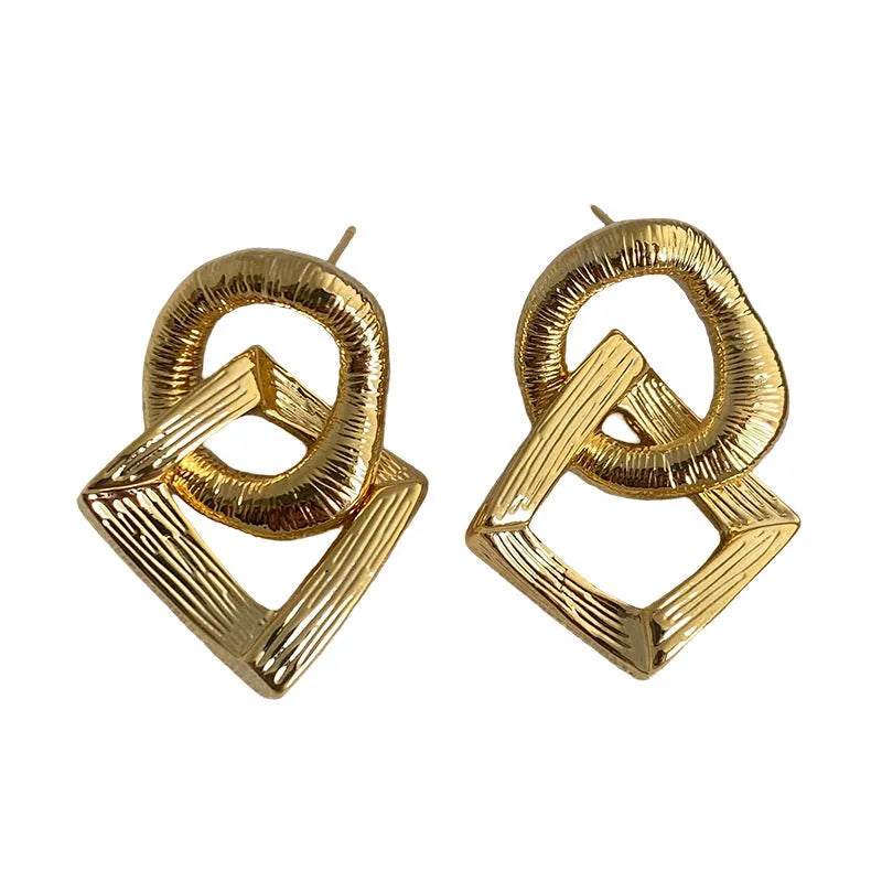 Retro geometric circle drop earrings in gold or silver finish measuring 3.4cm height