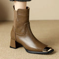 Brown cowhide leather women's ankle boots with a high heel and side zipper closure on a white background.