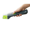 Green handheld plastic insect catcher for garden and lawn pest control.