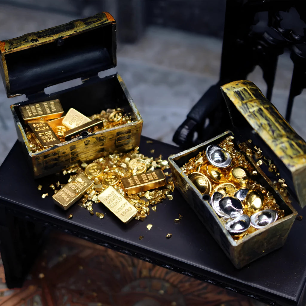 Miniature alloy treasure chest doll house ornament with gold coin and bar design.