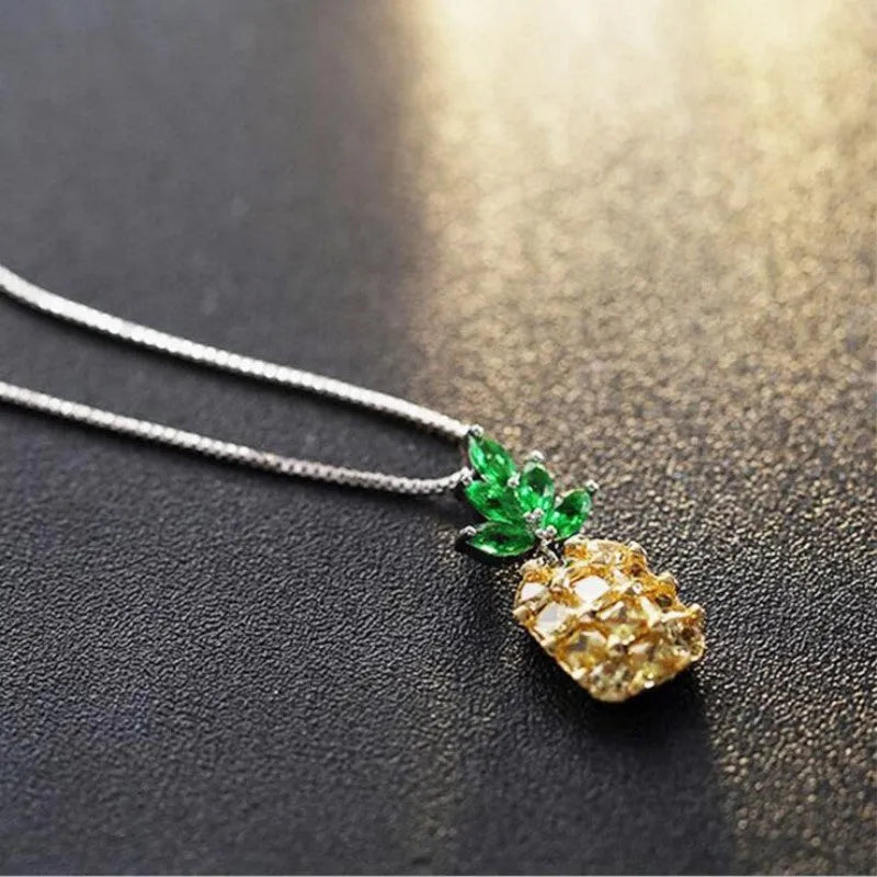 Silver plated women's necklace with a geometric pineapple diamond charm.