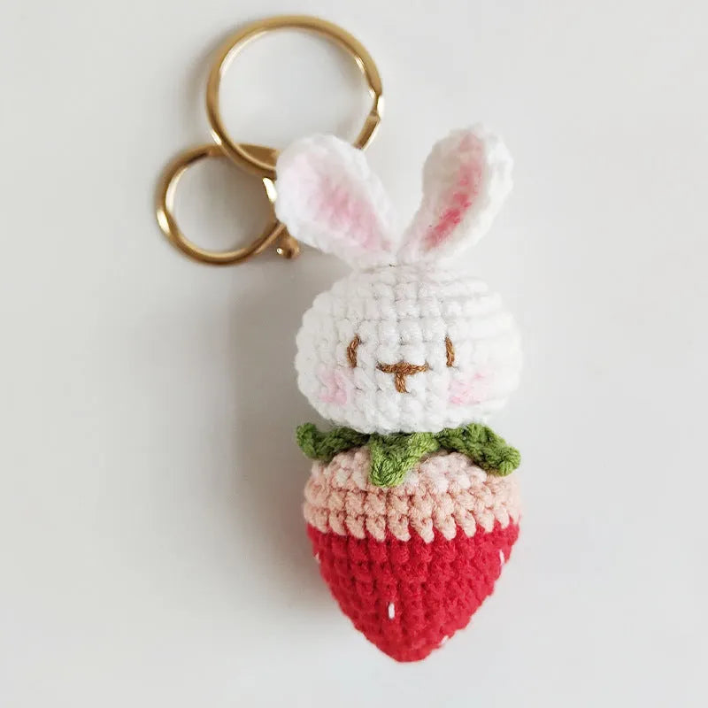 White hand-woven rabbit strawberry pendant charm with key attachment on four-strand doll wire