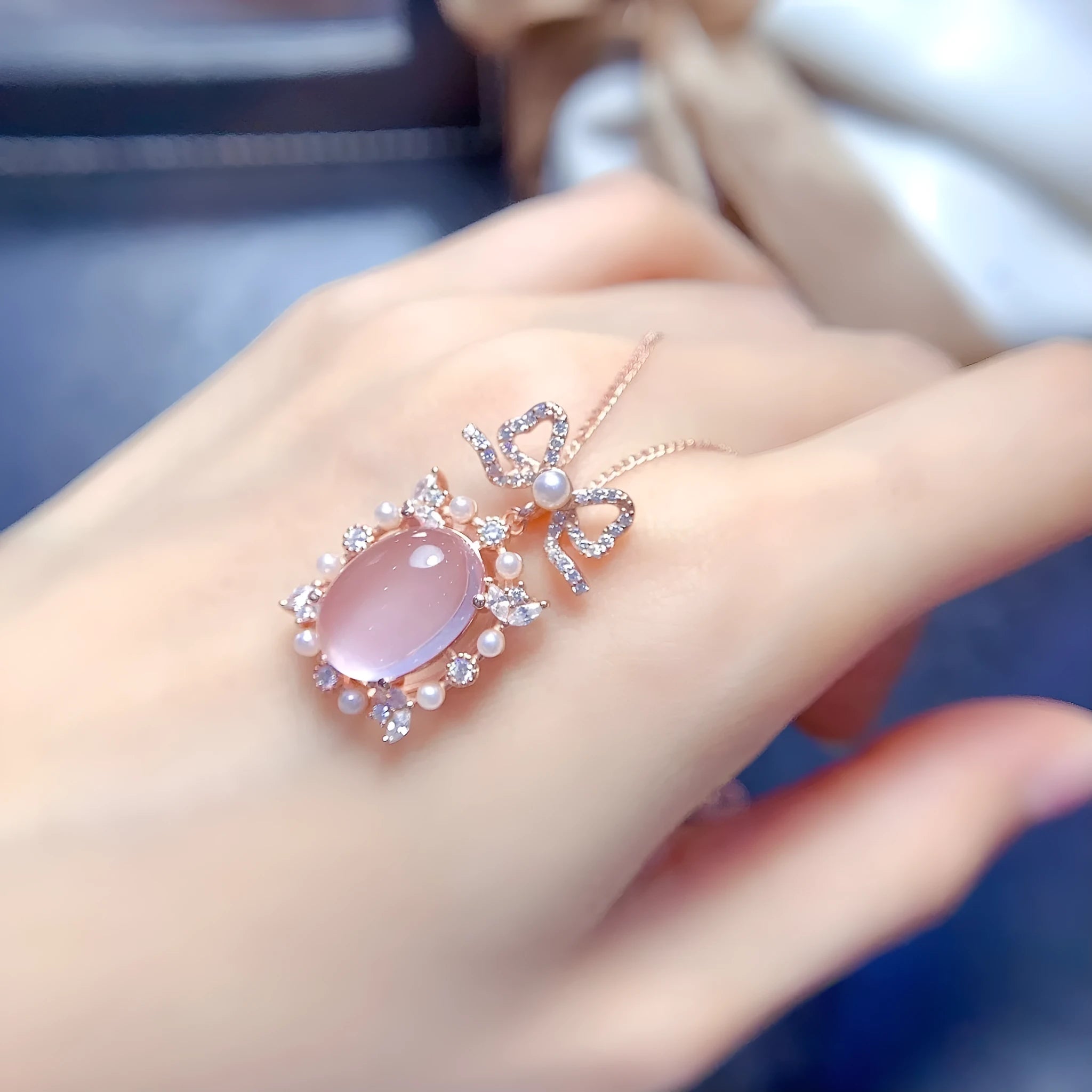 Geometric pendant necklace with pink rose quartz crystal in rose gold plated 925 silver setting.