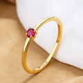 Copper geometric circle women's ring with a single diamond, shown in blue, green, red, and white colour options.