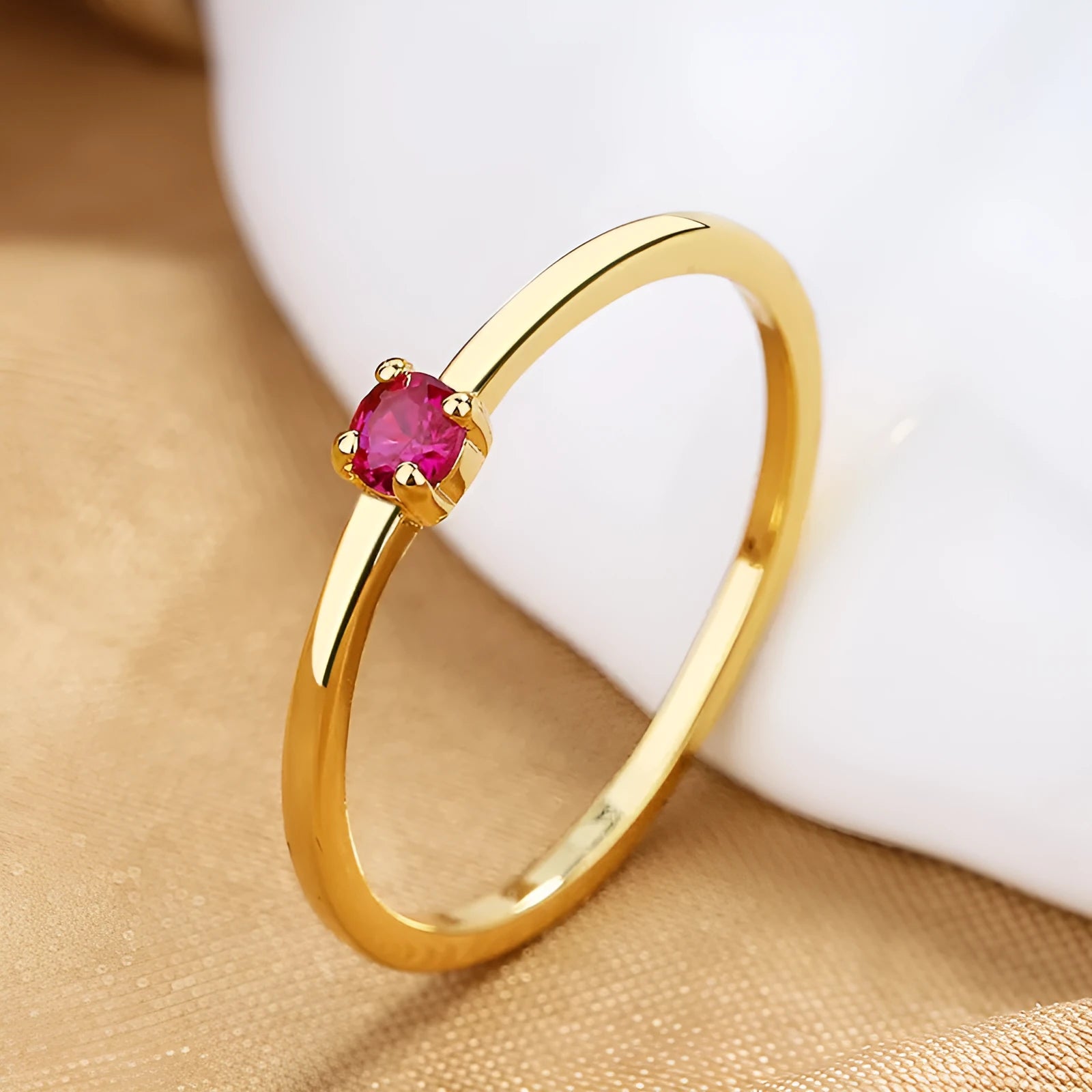 Copper geometric circle women's ring with a single diamond, shown in blue, green, red, and white colour options.