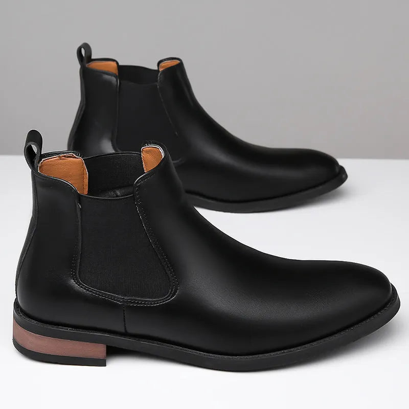 Men's black and light brown pointed toe Chelsea boots with a low heel and artificial PU upper