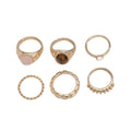 Light gold electroplated alloy ring set with six geometric and round designs for women