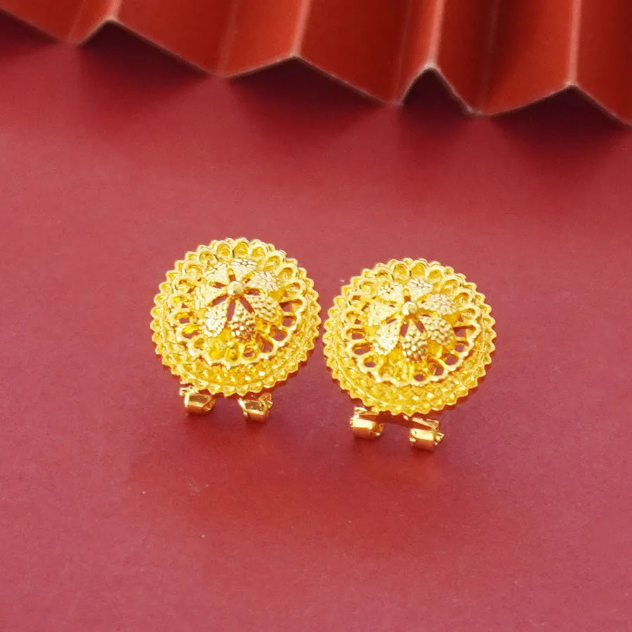 Gold electroplated floral design three-piece jewellery set showing necklace, earrings, and ring on water wave chain.