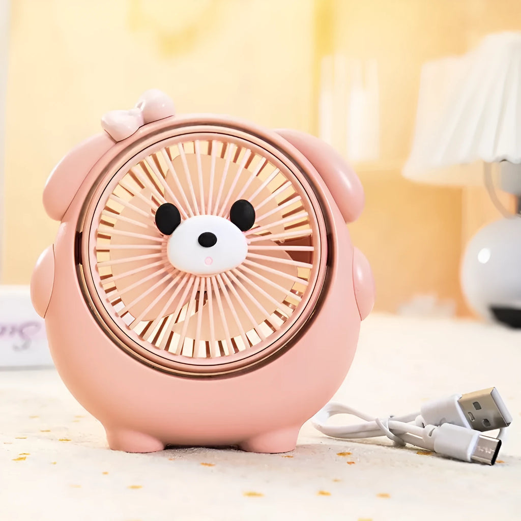 Cute dog design USB desktop electric fan in bear apricot colour on a wooden desk.