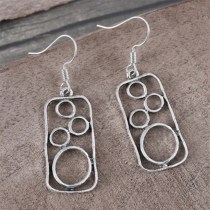 Geometric square earrings with round ring detailing in antique silver colour