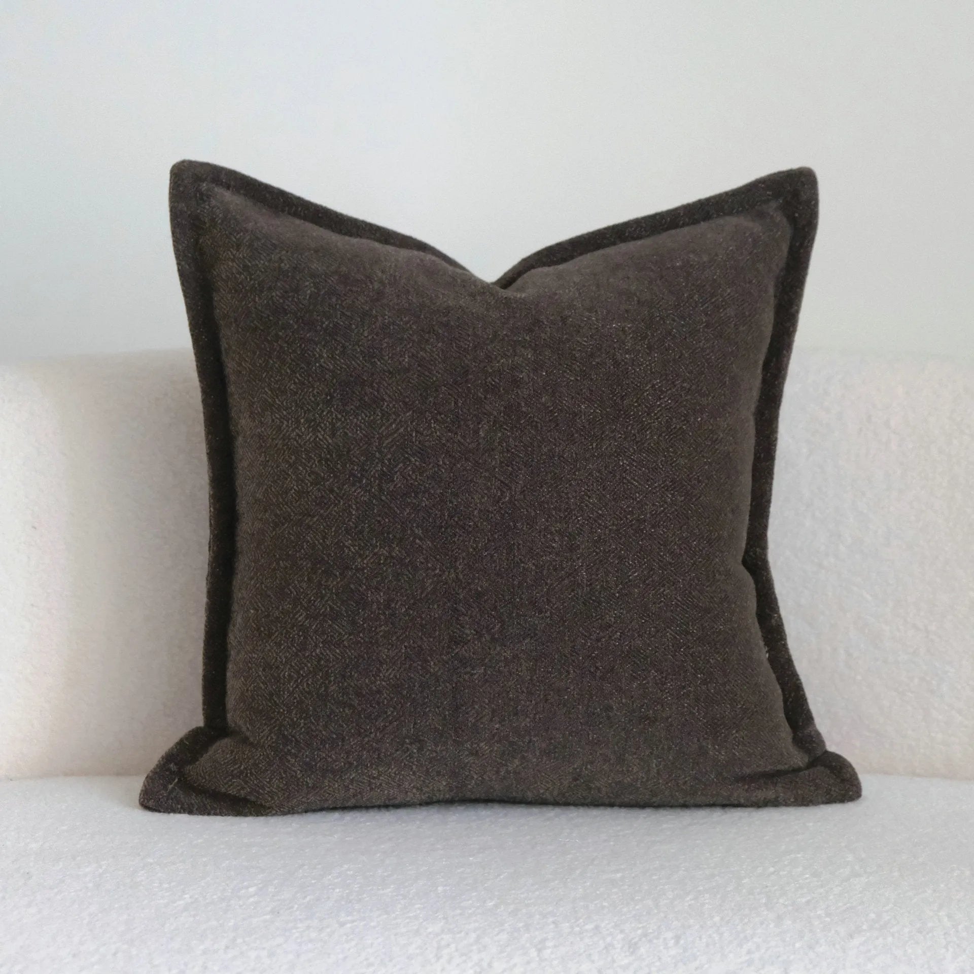Coffee brown striped mid-century modern cushion with Chinese classical design on sofa