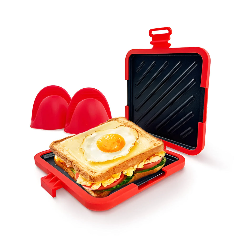 Red silicone baking tray with matching anti-scald gloves on kitchen counter