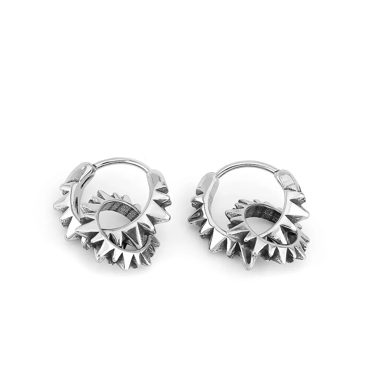 A pair of polished stainless steel round ring earrings with a steel colour finish on a white background.