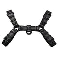 Black leather chest bondage strap with metal buckles on male torso