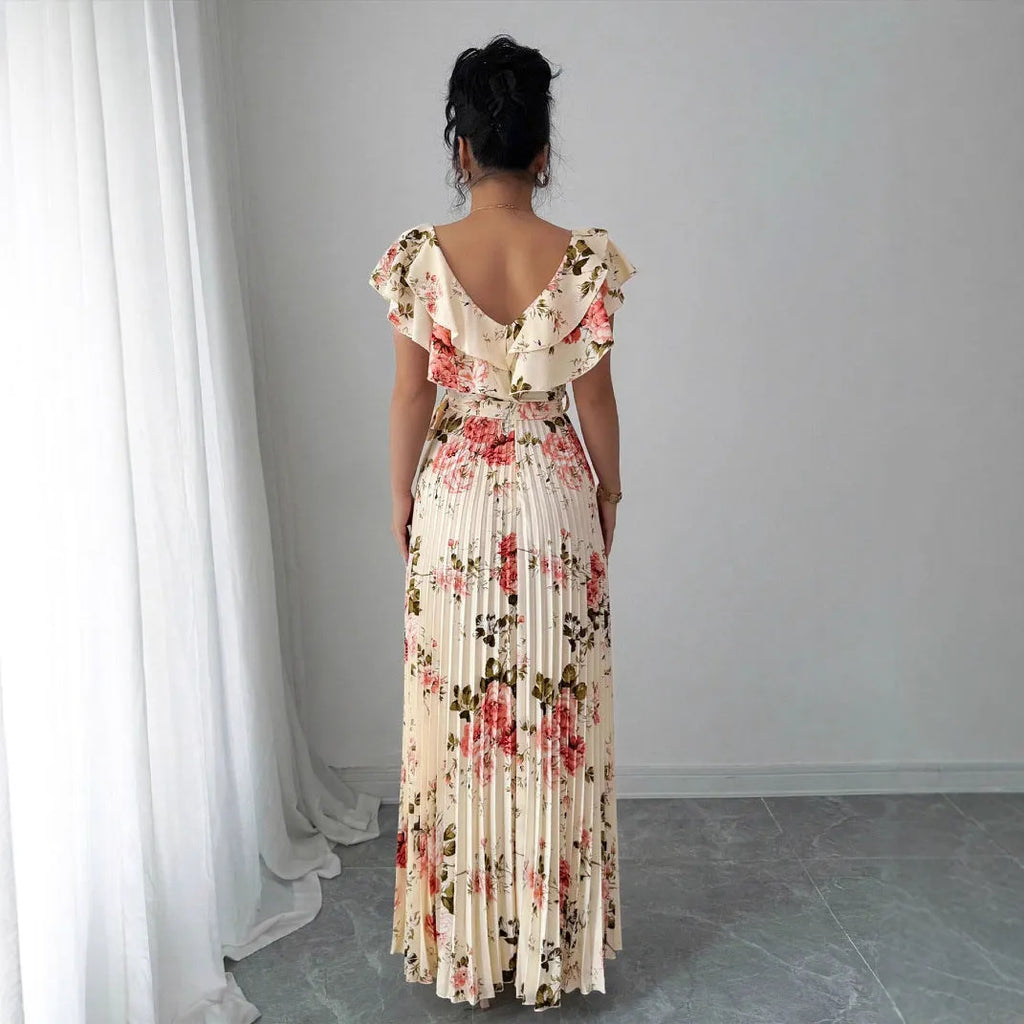 Apricot-coloured women's V-neck dress with a digital floral print, ruffled short sleeves, and a flowing oversized swing skirt.