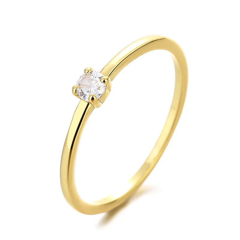 Copper geometric circle women's ring with a single diamond, shown in blue, green, red, and white colour options.
