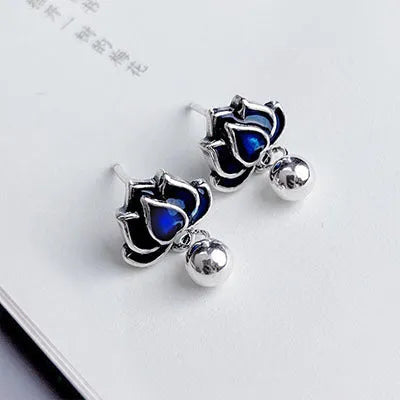 Blue Lotus earrings with lotus flower stud and seedpod tassel in vintage artistic style