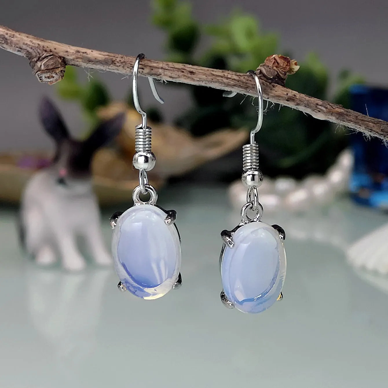 Moonlight white opal drop earrings with retro cross and ellipse design on alloy.