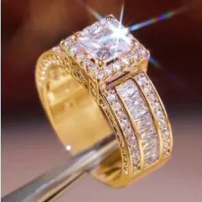 Women's geometric alloy ring with electroplated gold or white finish showing round design elements and available in sizes 5-13