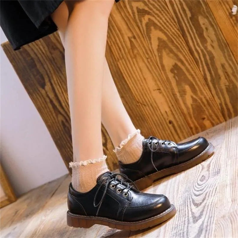 Women's black retro college-style Mary Jane shoes with square low heel and front lace-up closure