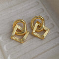 Retro geometric circle drop earrings in gold or silver finish measuring 3.4cm height