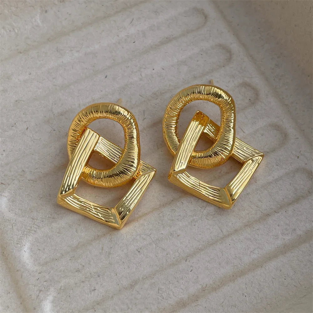Retro geometric circle drop earrings in gold or silver finish measuring 3.4cm height