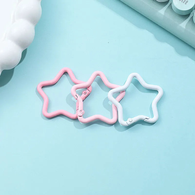 Zinc alloy five-pointed star keychain in macaron colours like light pink and green.
