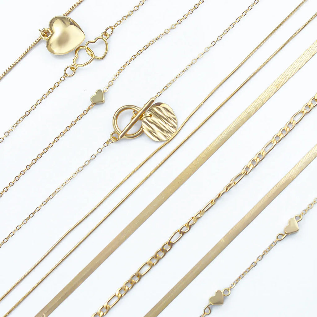 Women's 10 piece necklace set with gold electroplated finish and snake bone chain design