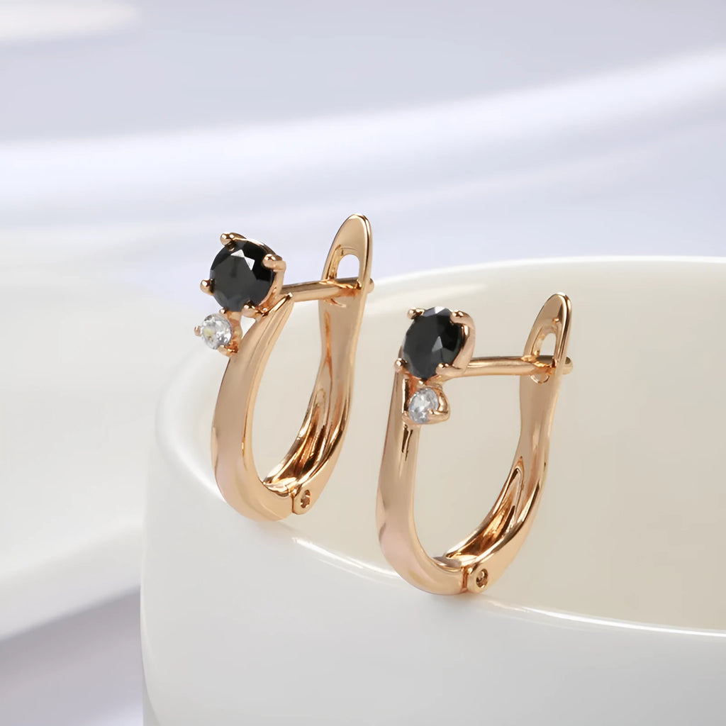Women's black agate drop earrings with geometric design in gold-plated copper setting