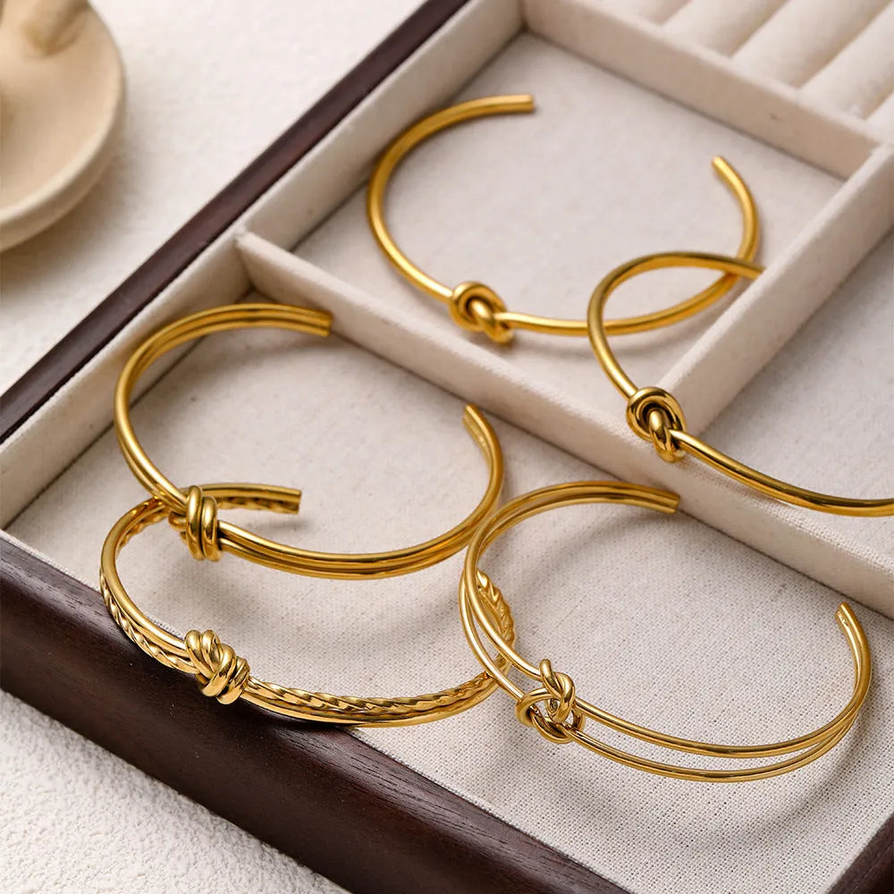 Adjustable stainless steel C-shaped bracelet with double-layer knotted design in gold or silver finish