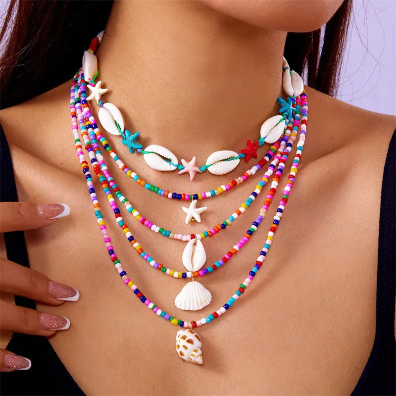 Women's starfish shell bead necklace five-piece set showing blue and multicolour designs with adjustable chains