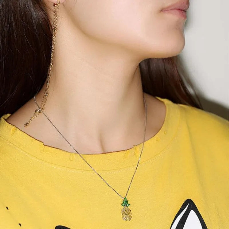 Silver plated women's necklace with a geometric pineapple diamond charm.