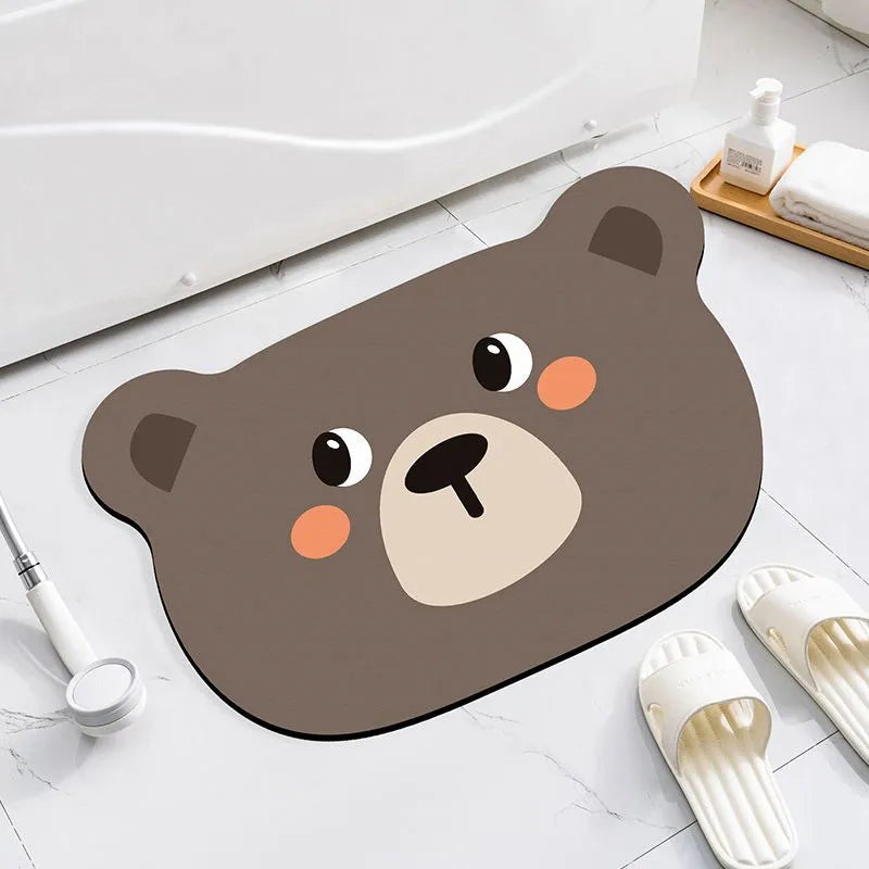 Thickened diatom ooze absorbent bathroom mat with cartoon animal design on a bathroom floor.