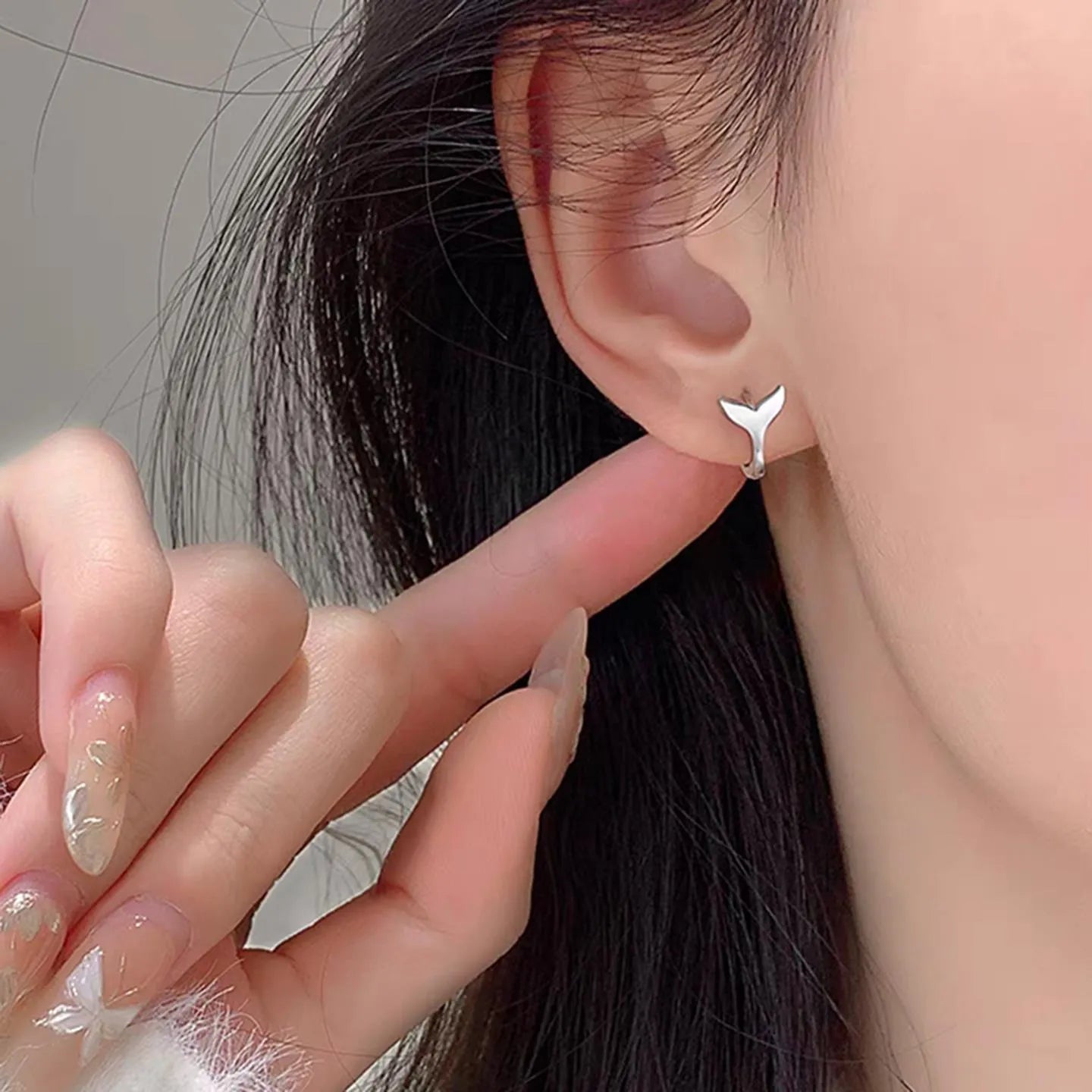 A pair of women's simple fishtail design earrings with an electroplated finish in a choice of colours.