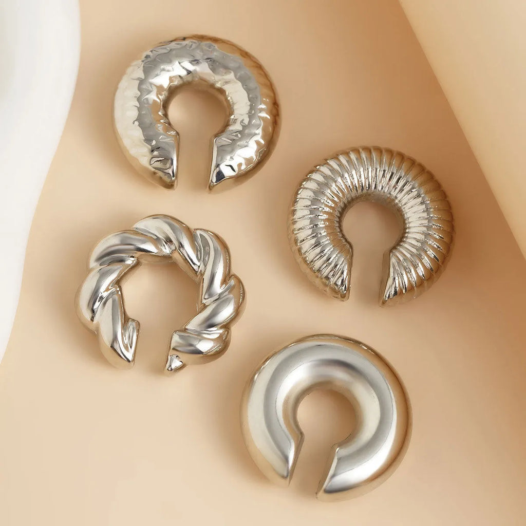 Set of four geometric gold and silver ear clips for non-pierced ears, ins style.
