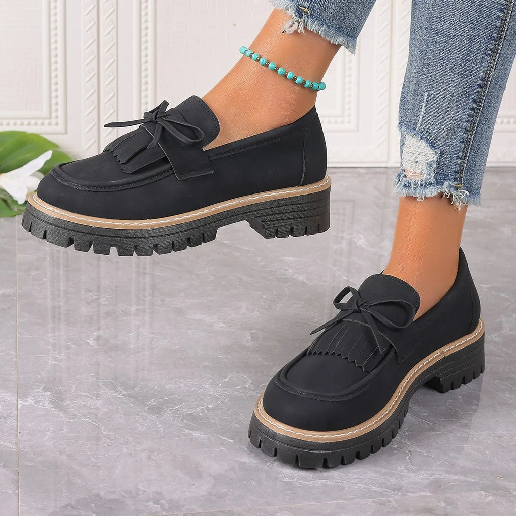 Plus size women's loafers with chunky heel in black and brown colours showing round toe design